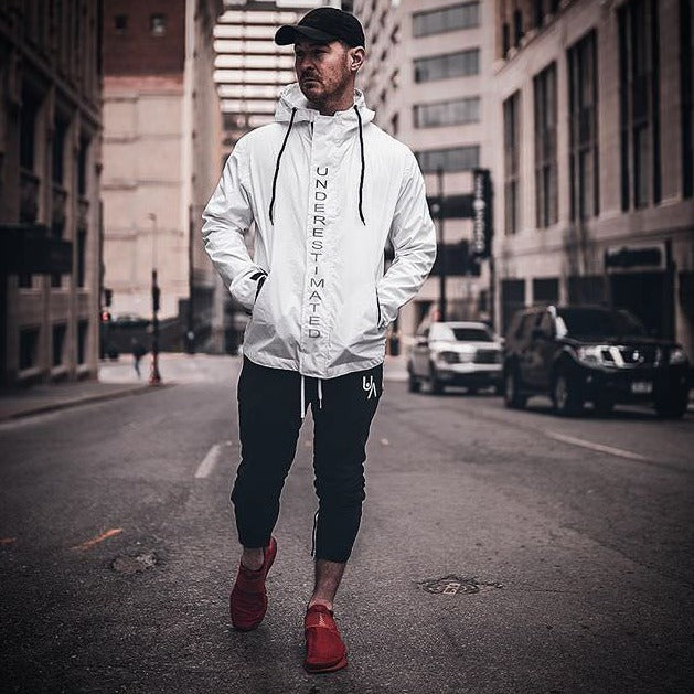 man in street wearing all-weather tech jacket