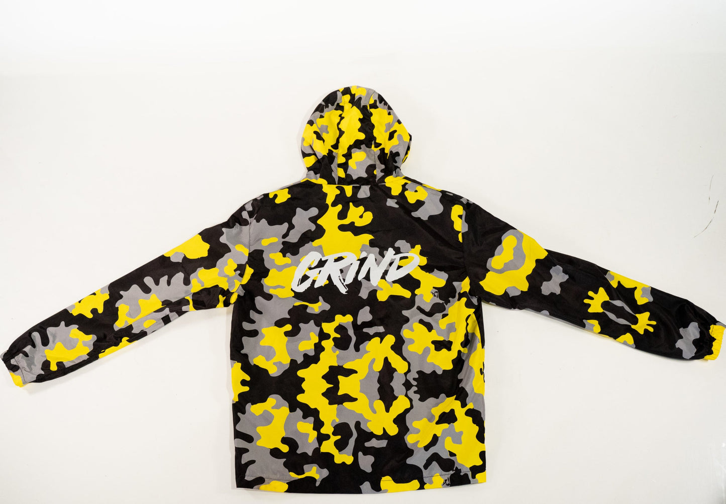 Back of yellow and gray grind camo windbreaker