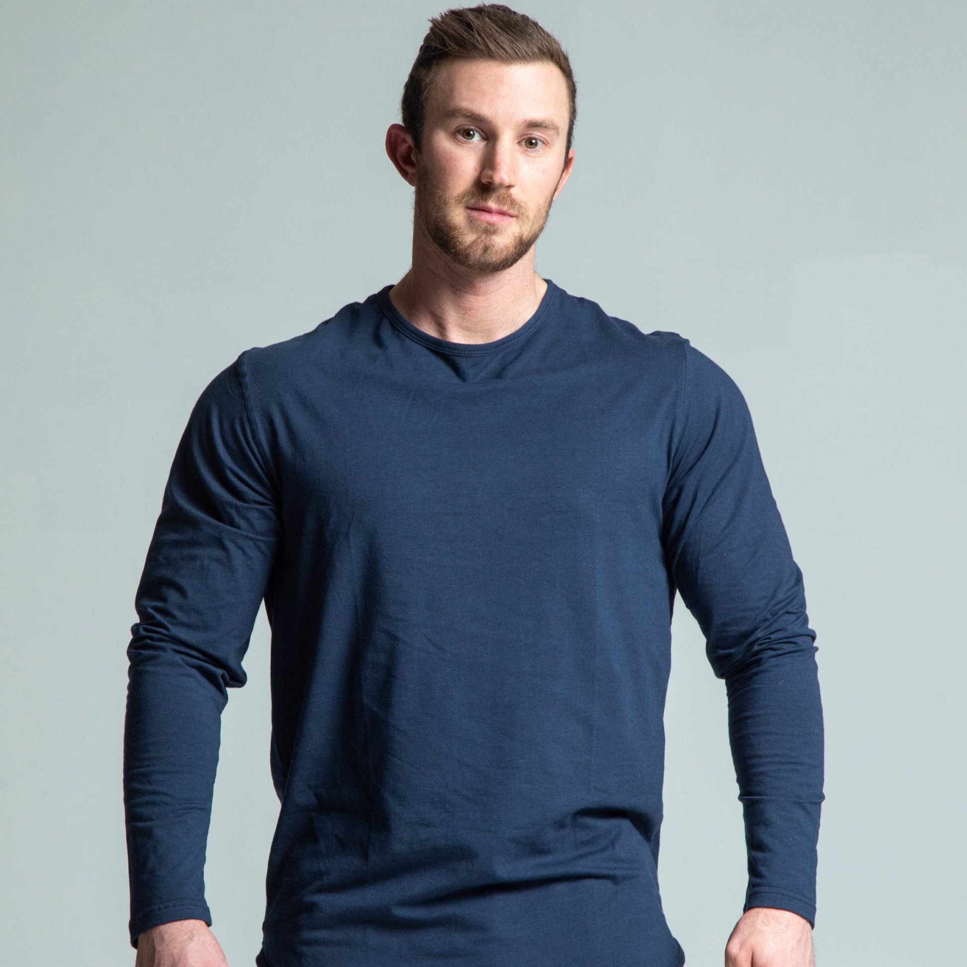 Front view of man wearing navy long sleeve tee
