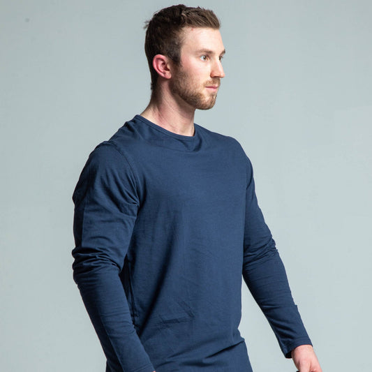 Angled view of man wearing navy long sleeve tee