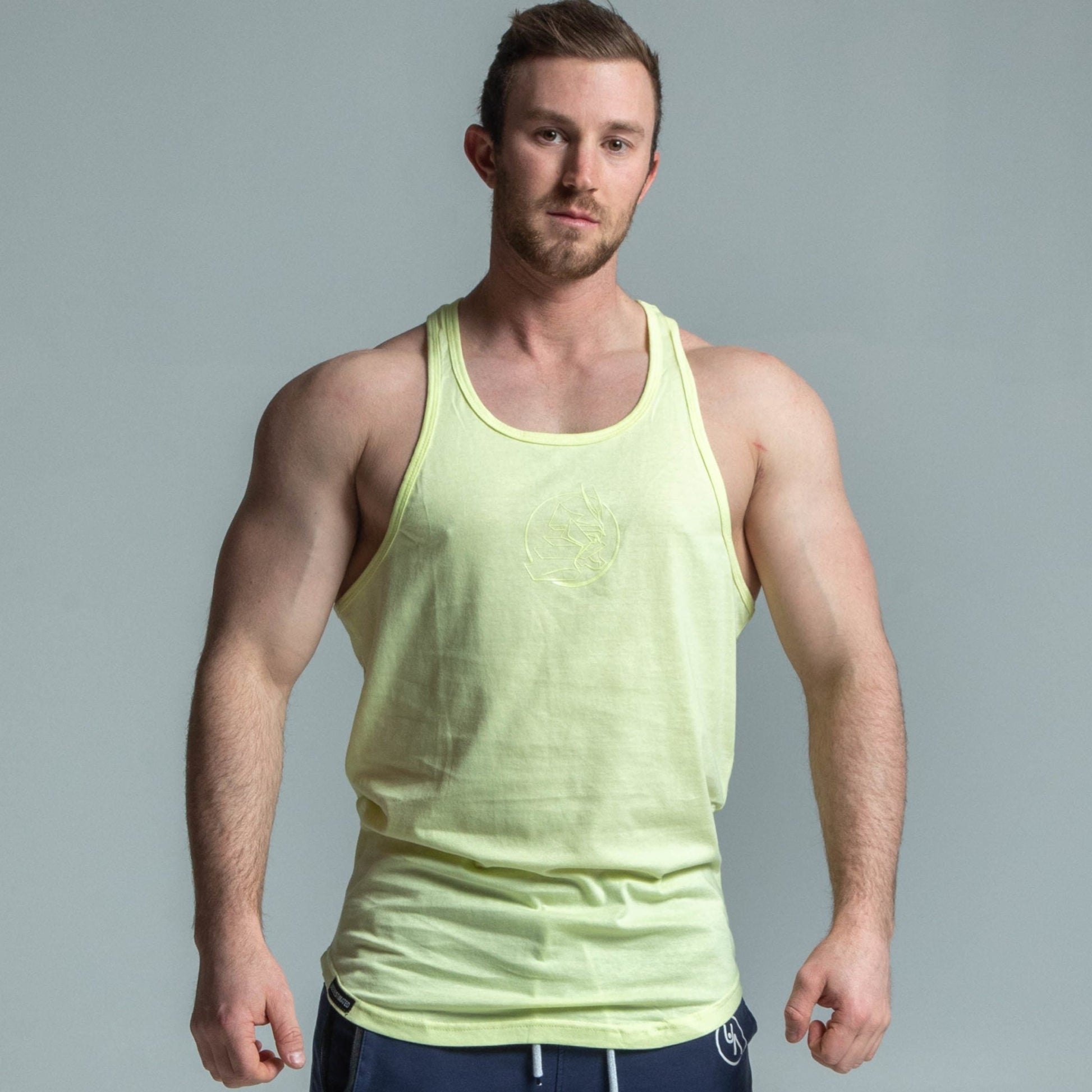 Front view of muscular man wearing yellow glow stringer