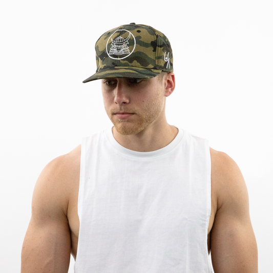 front view of man wearing camouflage snapback hat